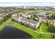 Aerial view of modern townhomes with well-manicured lawns and beautiful community surroundings at 7724 Sweet Star Ave, Orlando, FL 32836
