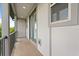 A narrow balcony with a metal railing, green doors and a view of trees at 7724 Sweet Star Ave, Orlando, FL 32836