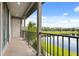 Relax on the balcony overlooking the serene pond and lush green landscape at 7724 Sweet Star Ave, Orlando, FL 32836