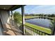 Breathe in the fresh air on the balcony with picturesque views of the calming lake at 7724 Sweet Star Ave, Orlando, FL 32836