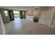 Spacious bonus room with tiled floors and French doors opening to a balcony and water view at 7724 Sweet Star Ave, Orlando, FL 32836