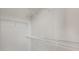 Walk-in closet features white shelving and white walls at 7724 Sweet Star Ave, Orlando, FL 32836