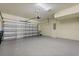 A spacious two-car garage with an automatic door opener and sealed concrete floor at 7724 Sweet Star Ave, Orlando, FL 32836
