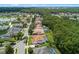 Aerial view of the neighborhood showcasing the homes, green spaces, and nearby lake at 824 Spring Island Way, Orlando, FL 32828