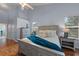 Charming bedroom features a vaulted ceiling, a ceiling fan, and a lovely wood floor at 824 Spring Island Way, Orlando, FL 32828
