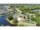 An aerial shot displaying community tennis and basketball courts, with a playground and lake at 824 Spring Island Way, Orlando, FL 32828