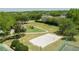 A community park offers a playground, sand volleyball and tennis courts in a lush green setting at 824 Spring Island Way, Orlando, FL 32828