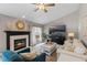 Cozy living room with a fireplace, neutral tones, and comfortable furniture, creating a warm atmosphere at 824 Spring Island Way, Orlando, FL 32828