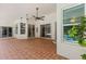 Expansive covered patio offers seamless indoor-outdoor living with views of the pool at 824 Spring Island Way, Orlando, FL 32828