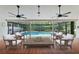 Inviting pool patio featuring a seating area and view of the sparkling pool surrounded by lush landscaping at 824 Spring Island Way, Orlando, FL 32828