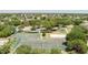 Aerial view of a community featuring tennis and basketball courts, a beach volleyball court, playground, and green space at 824 Spring Island Way, Orlando, FL 32828