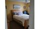 Cozy bedroom with yellow walls, comfortable bed, and a serene ambiance at 8539 Clematis Ln, Orlando, FL 32819