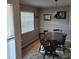 Cozy dining room with dark wood table set and natural light at 8539 Clematis Ln, Orlando, FL 32819