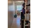 Functional laundry room with tile floors, shelves, and storage solutions at 8539 Clematis Ln, Orlando, FL 32819