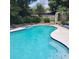 Sparkling blue swimming pool with landscaped surroundings and inviting atmosphere at 8539 Clematis Ln, Orlando, FL 32819