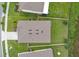 An aerial view displays a home with a backyard, green grass, a fence, and a roof with vents at 868 Brooklet Dr, Davenport, FL 33837