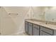 Contemporary bathroom offers a double vanity with granite counters and plenty of space at 868 Brooklet Dr, Davenport, FL 33837