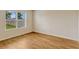 Sunlit bedroom with wood floors and window view at 868 Brooklet Dr, Davenport, FL 33837