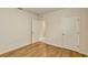 Spacious bedroom with hardwood flooring and multiple doorways at 868 Brooklet Dr, Davenport, FL 33837