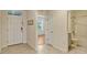 Inviting foyer with tiled floors, showcasing a hallway, bathroom and bright living space at 868 Brooklet Dr, Davenport, FL 33837