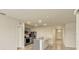 Modern kitchen features a center island, stainless steel appliances, and gray cabinets at 868 Brooklet Dr, Davenport, FL 33837