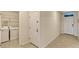 A laundry room showing a white washer and dryer set, and tile flooring at 868 Brooklet Dr, Davenport, FL 33837