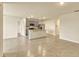 Open-concept living area flows into the kitchen with tile flooring and neutral paint at 868 Brooklet Dr, Davenport, FL 33837