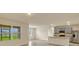 Spacious living area open to kitchen, features ample natural light and modern finishes at 868 Brooklet Dr, Davenport, FL 33837