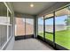 A screened-in patio offers an outdoor space, with views of the yard and privacy with retractable shades at 868 Brooklet Dr, Davenport, FL 33837