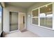 A cozy screened patio features a welcome mat, an interior entrance, and a decorative wall ornament at 868 Brooklet Dr, Davenport, FL 33837