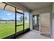 Relaxing screened patio providing a view to the backyard, as well as a seamless transition indoors at 868 Brooklet Dr, Davenport, FL 33837