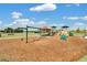 A colorful playground featuring swings, slides, and picnic tables, perfect for families to enjoy outdoor recreation at 868 Brooklet Dr, Davenport, FL 33837