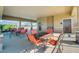 Inviting covered seating area with tables and chairs is perfect for socializing and enjoying the outdoors at 868 Brooklet Dr, Davenport, FL 33837