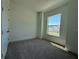 Cozy bedroom featuring plush carpeting, natural light, and neutral tones for a relaxing ambiance at 931 Azalea Walk Cir, Deland, FL 32724