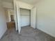 Bedroom closet showcasing ample storage space and a well-organized layout at 931 Azalea Walk Cir, Deland, FL 32724