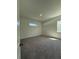 Bedroom featuring neutral carpeting, and natural light from a window; clean walls at 931 Azalea Walk Cir, Deland, FL 32724