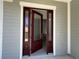 Elegant front door with glass panels, showcasing the home's inviting entrance and modern design at 931 Azalea Walk Cir, Deland, FL 32724
