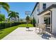Lush backyard with a basketball court and seating area, perfect for outdoor activities and enjoying the beautiful surroundings at 10829 Royal Cypress Way, Orlando, FL 32836