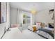 Bright ' bedroom featuring two cozy beds, a large window, and a functional desk area at 10829 Royal Cypress Way, Orlando, FL 32836