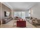 Sophisticated living room with stylish furnishings, a large window, and elegant decor at 10829 Royal Cypress Way, Orlando, FL 32836