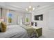 Bright main bedroom featuring ample natural light and a contemporary design at 10829 Royal Cypress Way, Orlando, FL 32836