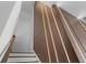 Unique stairway featuring a modern wood paneled wall with linear lighting accents at 10829 Royal Cypress Way, Orlando, FL 32836
