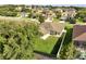 Aerial view of a home with a fenced yard and well-maintained landscaping in a residential area at 10955 Lemay Dr, Clermont, FL 34711