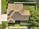 A bird's-eye view of the home's roof, backyard, and surrounding landscape at 10955 Lemay Dr, Clermont, FL 34711