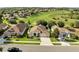 Desirable neighborhood featuring houses with well-manicured lawns, mature landscaping, and stunning views at 10955 Lemay Dr, Clermont, FL 34711