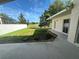 Back yard featuring well-maintained lawn and view of golf course at 10955 Lemay Dr, Clermont, FL 34711