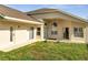 The backyard patio boasts a ceiling fan and abundant space for relaxation at 10955 Lemay Dr, Clermont, FL 34711