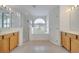 Bright bathroom showcasing separate tub, shower and dual vanities at 10955 Lemay Dr, Clermont, FL 34711