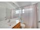 Bathroom featuring a shower/tub combo, vanity, and neutral-toned decor at 10955 Lemay Dr, Clermont, FL 34711