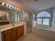 Bright bathroom featuring a soaking tub, separate shower, and double vanity at 10955 Lemay Dr, Clermont, FL 34711